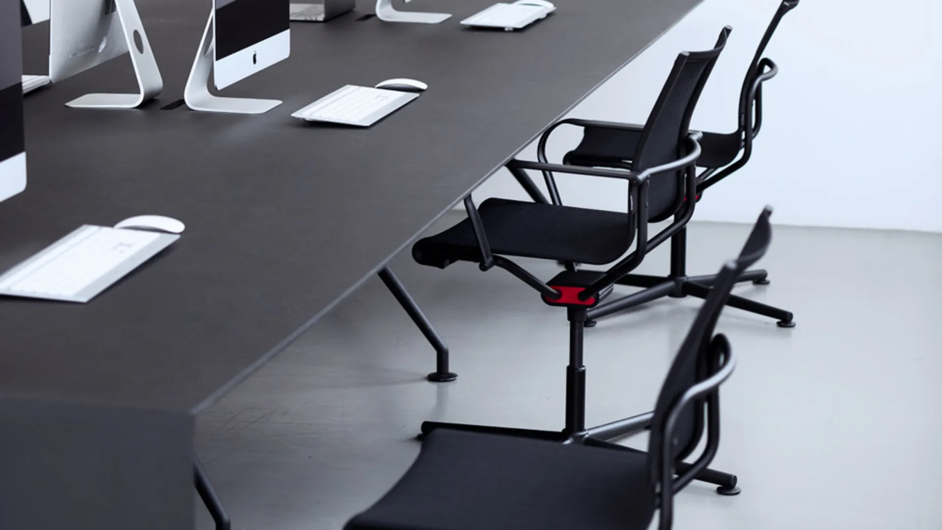 Black office chairs at a desk Black office chairs at a desk