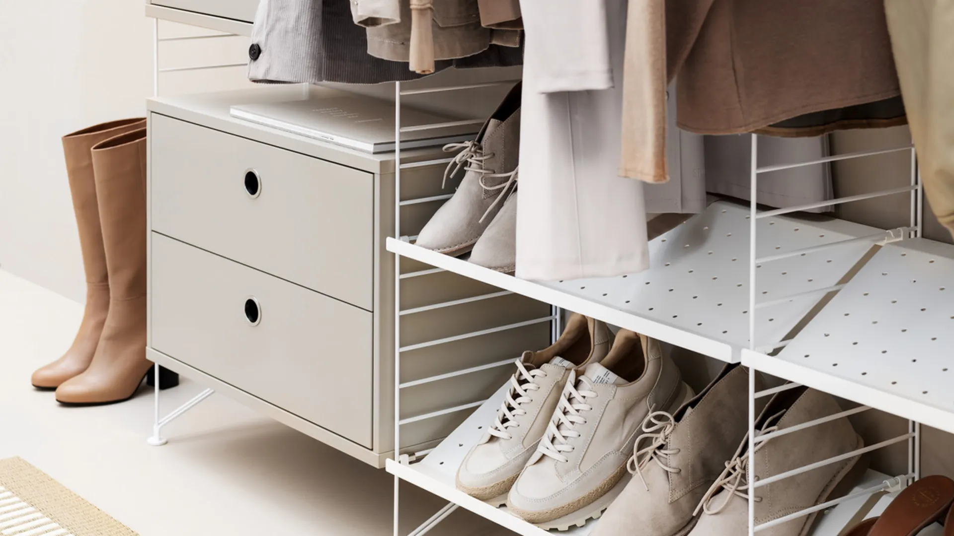 Open shelving system with drawers, clothing and shoes Open shelving system with drawers, clothing and shoes