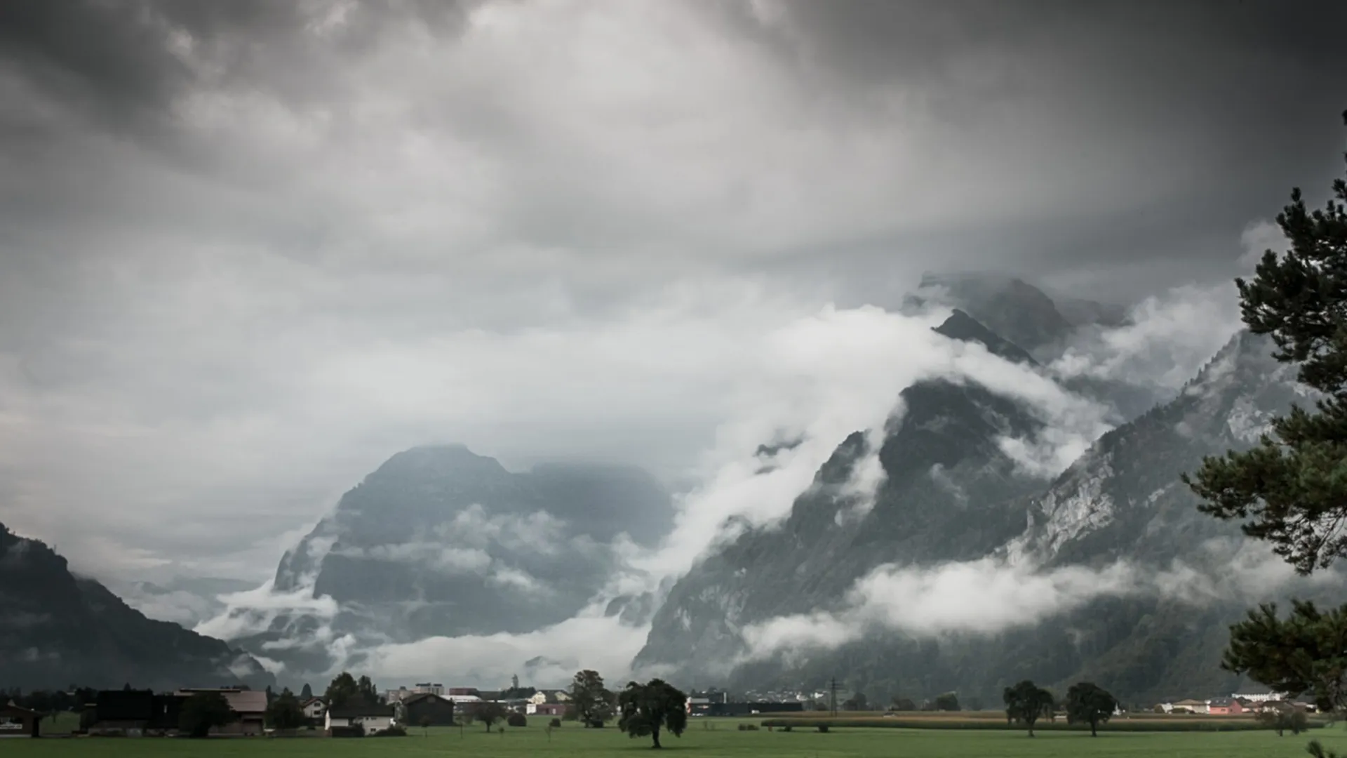Mountain landscape with clouds and green meadows Mountain landscape with clouds and green meadows