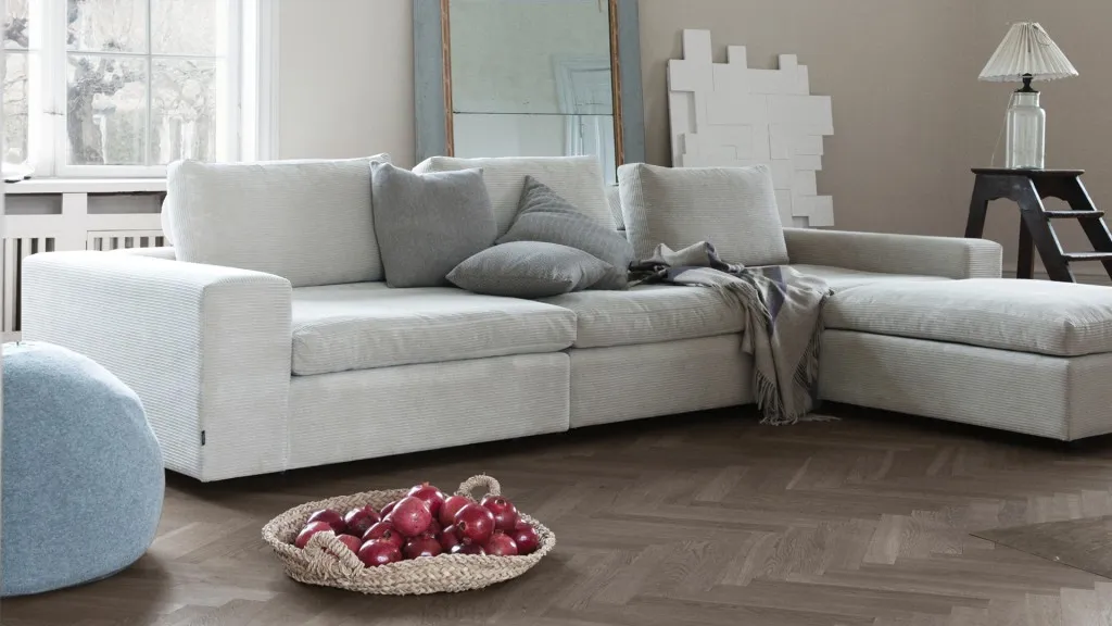 Light corner sofa in a spacious living room Light corner sofa in a spacious living room